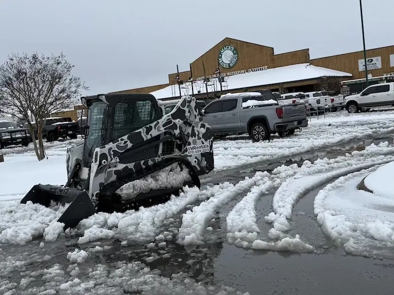 WI Rentals skid steer providing snow removal service in Stuttgart, Arkansas
